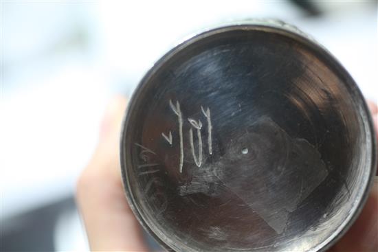 Two Indian white metal beakers, each embossed with scenes of women making offerings to Lord Shiva